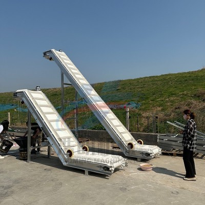 白色PVC裙邊皮帶輸送機(jī)帶隔板顆粒粉末提升輸送機(jī)水平傾斜上料機(jī)